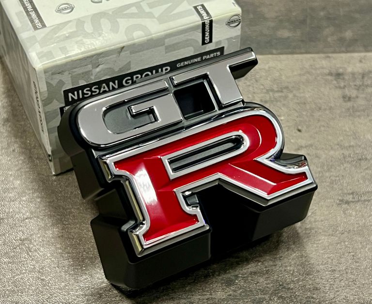 Nissan GT-R-Kühlergrillemblem Skyline R33 BCNR33 62896-24U00 – Ansicht 1